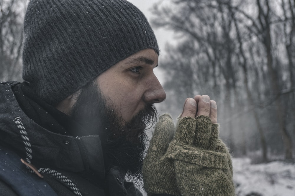 man wearing gray knit capp