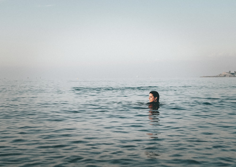 person on body of water during daytime