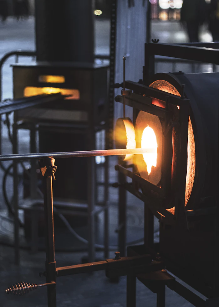 Two torches working a single piece of glass together