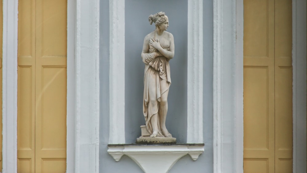 woman in white dress statuette