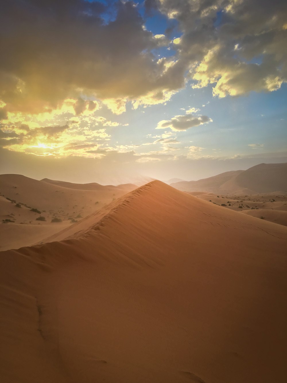 desert under white and blue sky