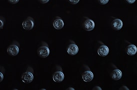 close-up photography of glass bottles with lid