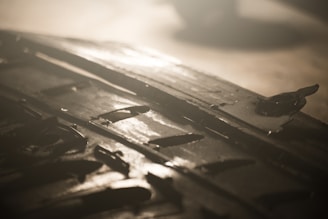 Close-up of a sleek, glossy industrial floor with subtle texture under dramatic lighting.