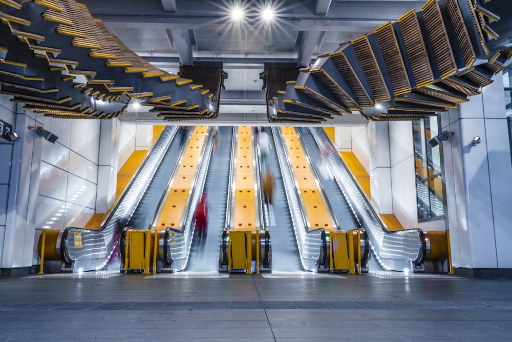 time lapse photo of people in escalator