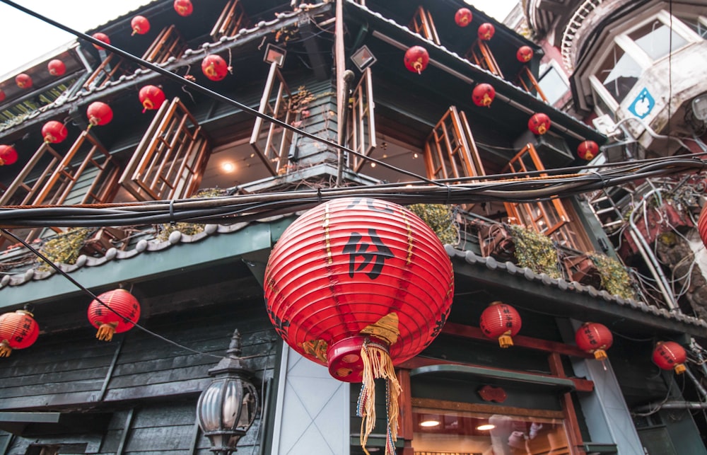 red Chinese lantern hanging on building
