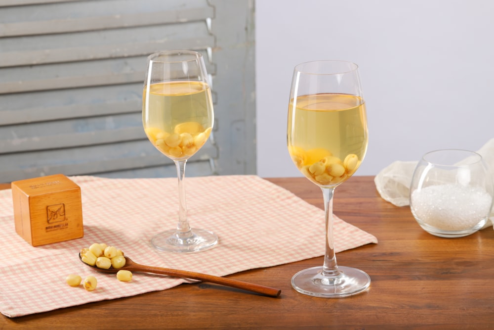 two tulip wine glasses on table