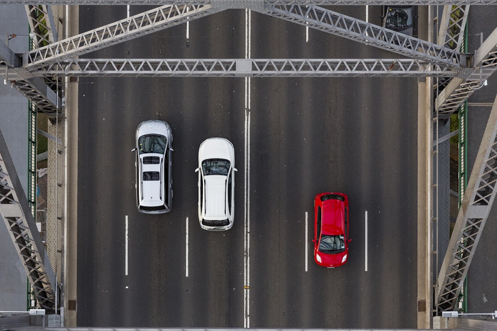 aerial photo of three cars