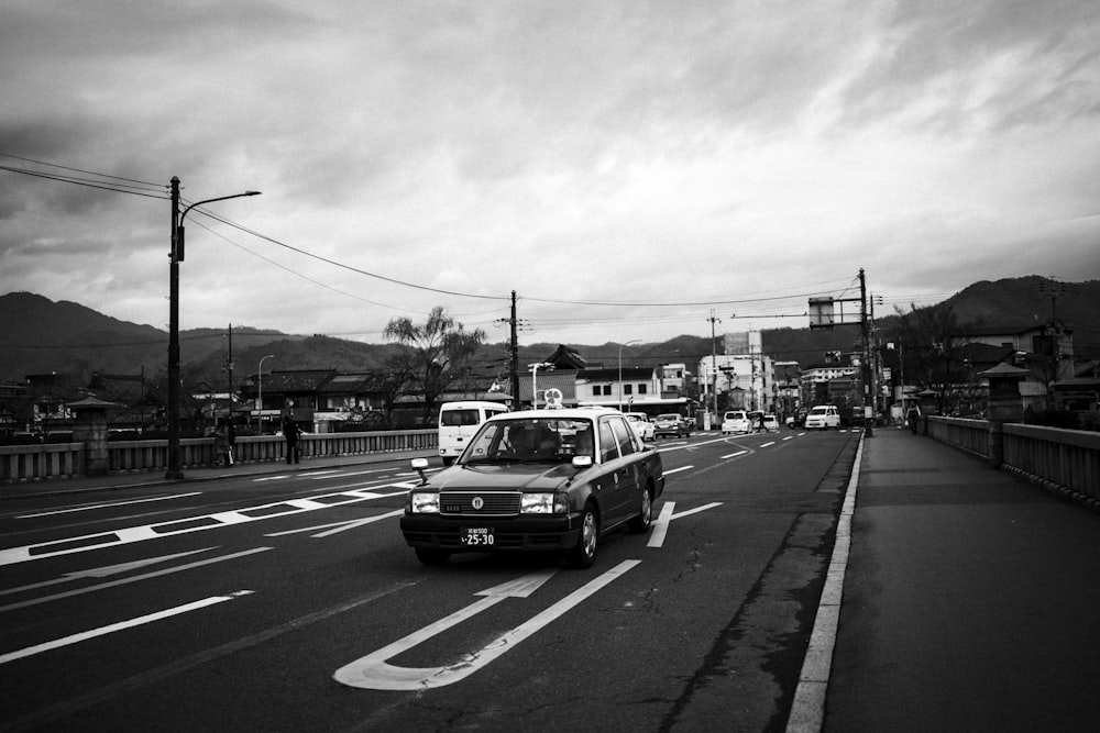 different cars on road near buildings