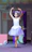 Children dressed in ballet tutus smiling and dancing during a birthday party at the ballet school.