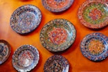 Close-up of vibrant, hand-painted ceramic pieces from our home deco collection.