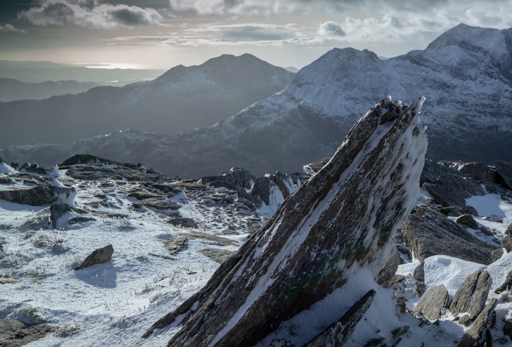 jagged rock butte on snow covered mountain top