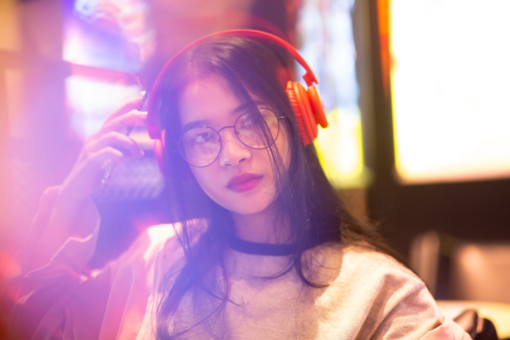 woman using headphones and looking side view