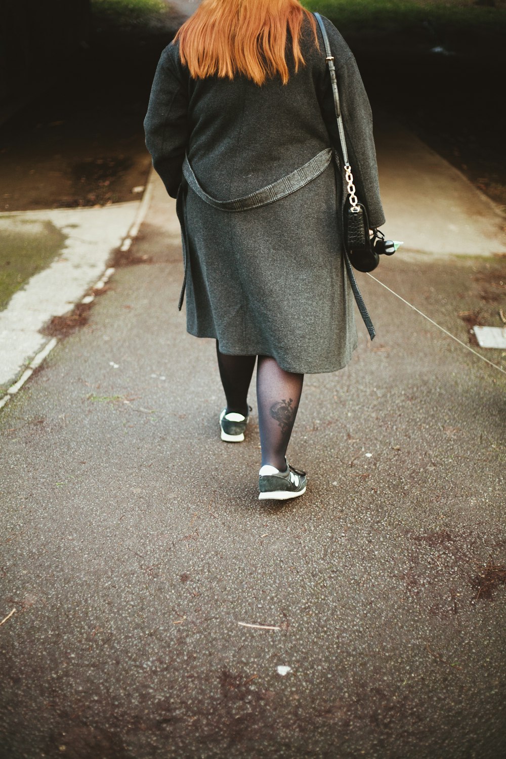 woman walking on road