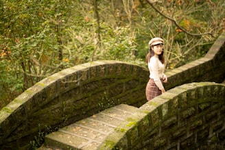 woman standing on arch walkway