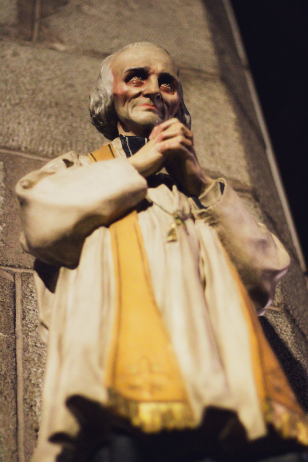 smiling man in white statue