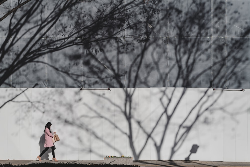 woman walking on sidewalk