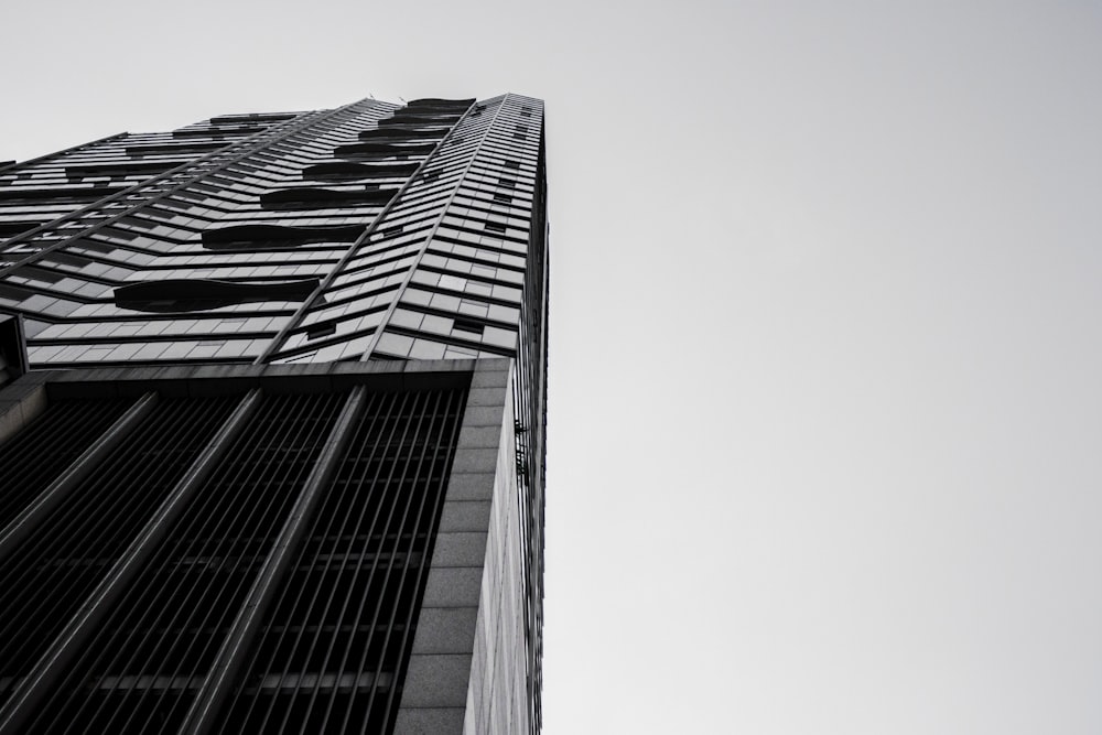 low angle grayscale photo of high rise building
