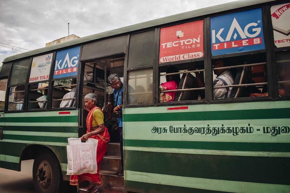 woman stepping out of the bus during daytime