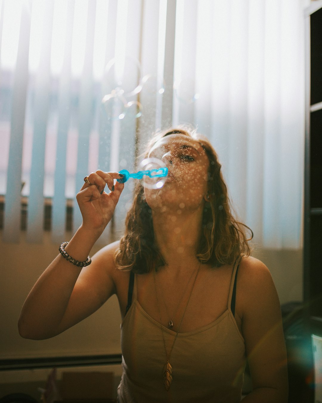 woman playing balloon indoor