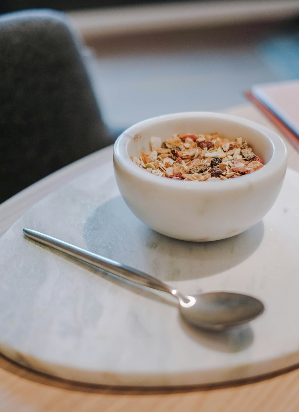 stainless steel spoon beside bowl