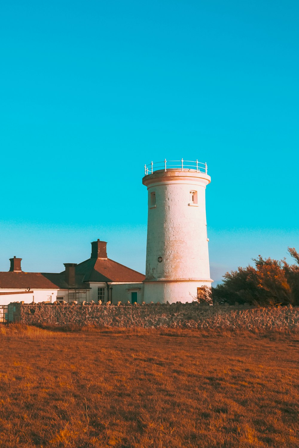 white lighthouse under blue skt