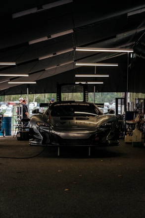 A well-maintained Ferrari in a service garage.