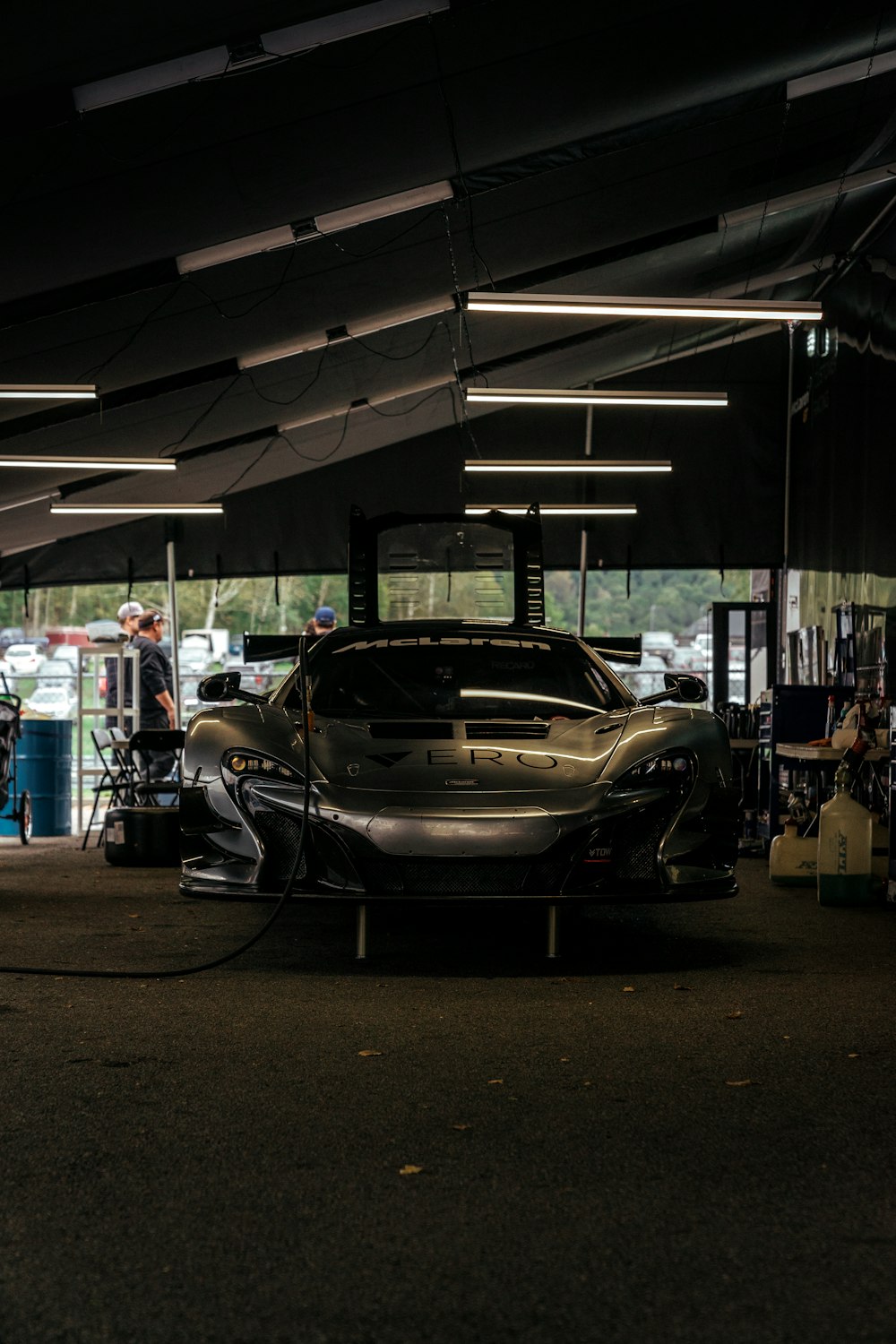 silver sports coupe parked during daytime