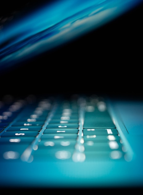 closeup photo of turned-on blue and white laptop computer