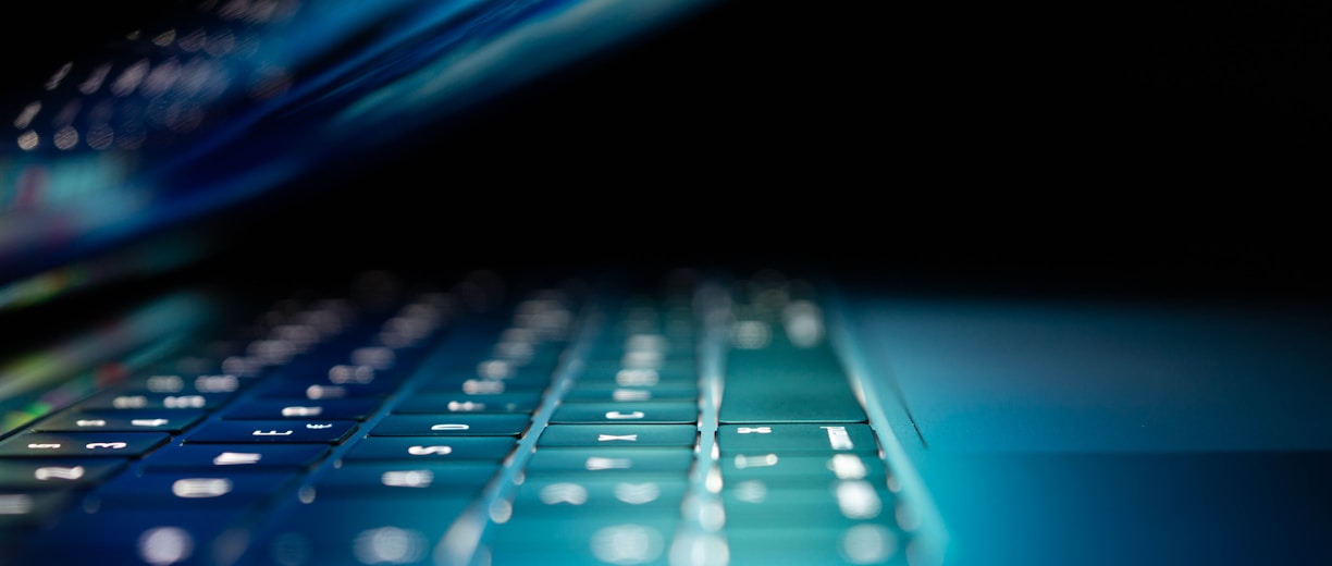 closeup photo of turned-on blue and white laptop computer