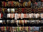 An assortment of bracelets arranged artfully on a marble background.