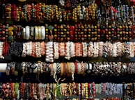An assortment of bracelets made from both gold and silver, showcasing variety.