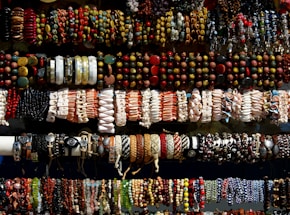 A collection of colorful clay bead bracelets displayed elegantly.