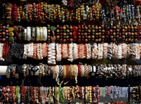 An assortment of stylish bracelets displayed elegantly on a soft fabric background.