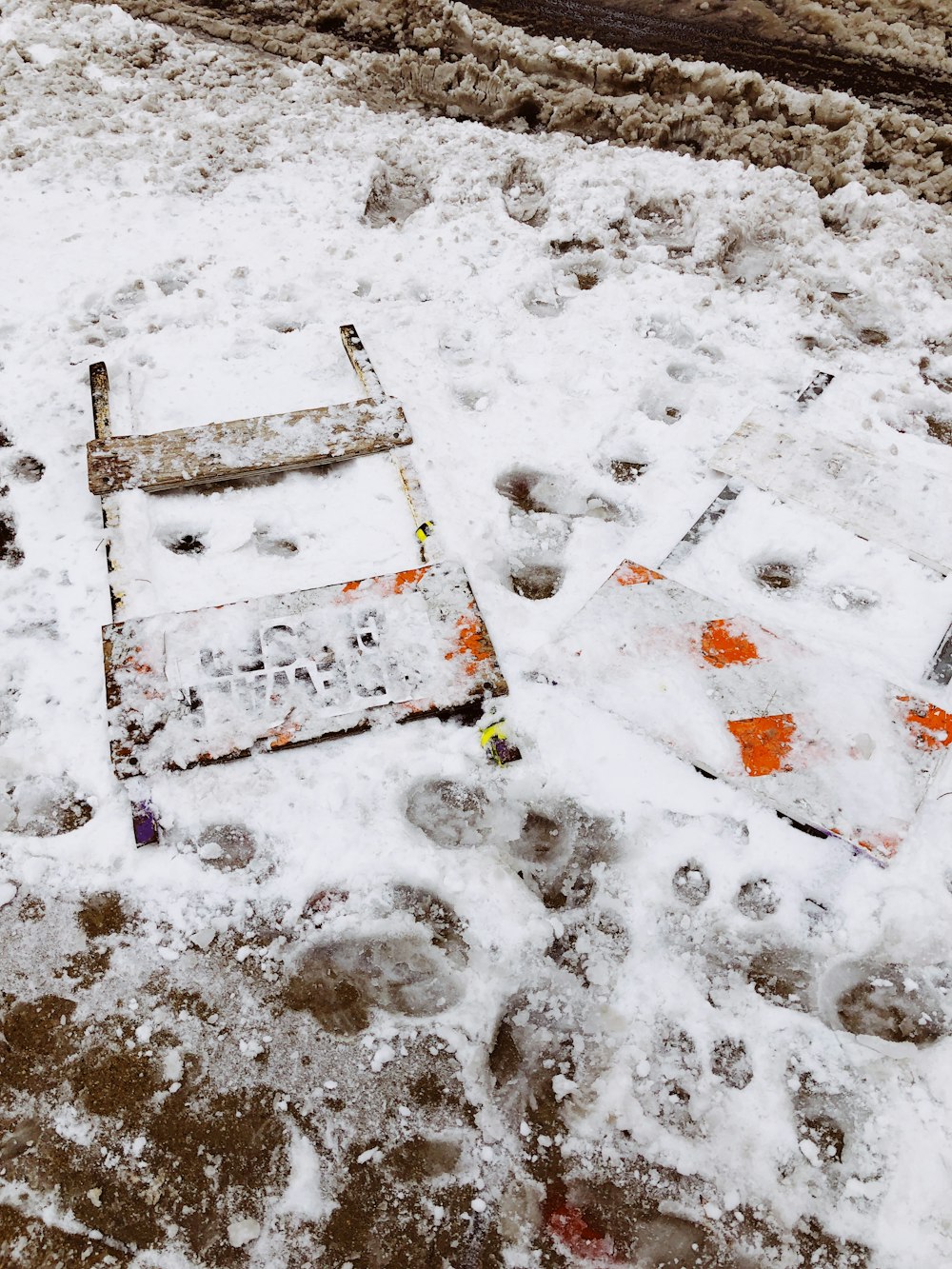 a couple of signs that are in the snow