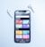 A smartphone displaying a music streaming app interface is placed on a light blue surface. The screen shows various musical genres and options in colorful boxes, including Rock, Electronic/Dance, Pop, Indie, Podcasts, Charts, New Releases, and Radio. Two white wireless earbuds are positioned on either side of the phone.