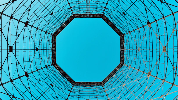 low angle photo of blue sky under circular tower