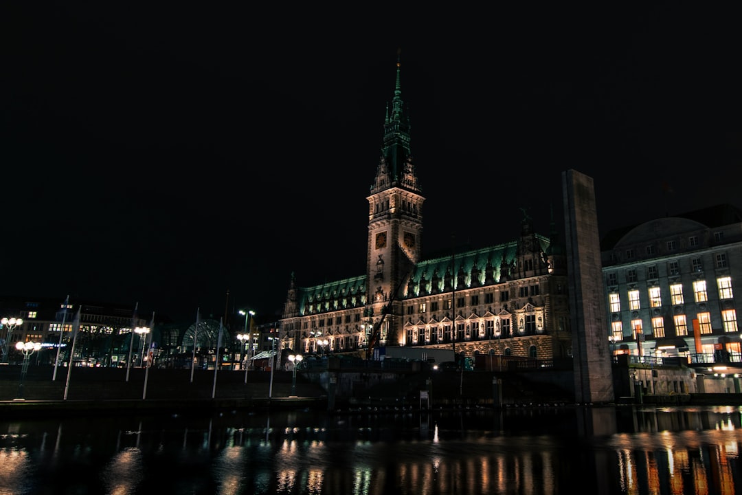 lighted building with tower during night time