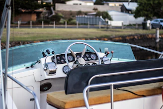 Wide shot of a boat on the dyno machine with staff monitoring performance data on screens.