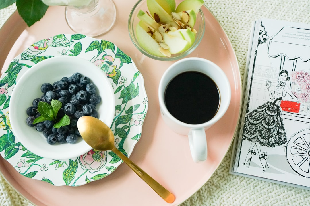 brewed coffee in white ceramic mug beside sliced apples