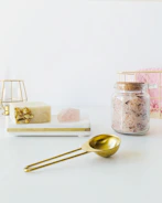 Guestroom accessories including custom soap dispensers and elegant amenity trays