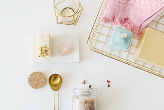 spray bottles on rack beside lamp and dessert
