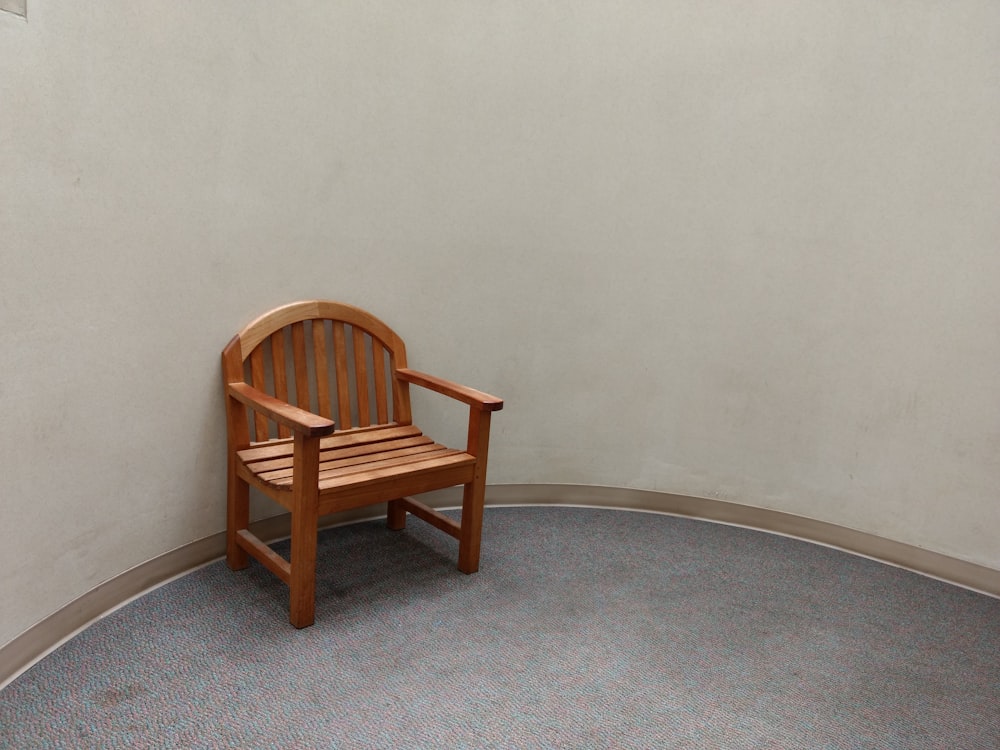 vacant brown wooden armchair
