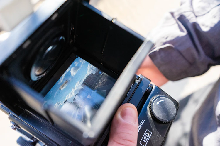 A person holding a camera in their hand
