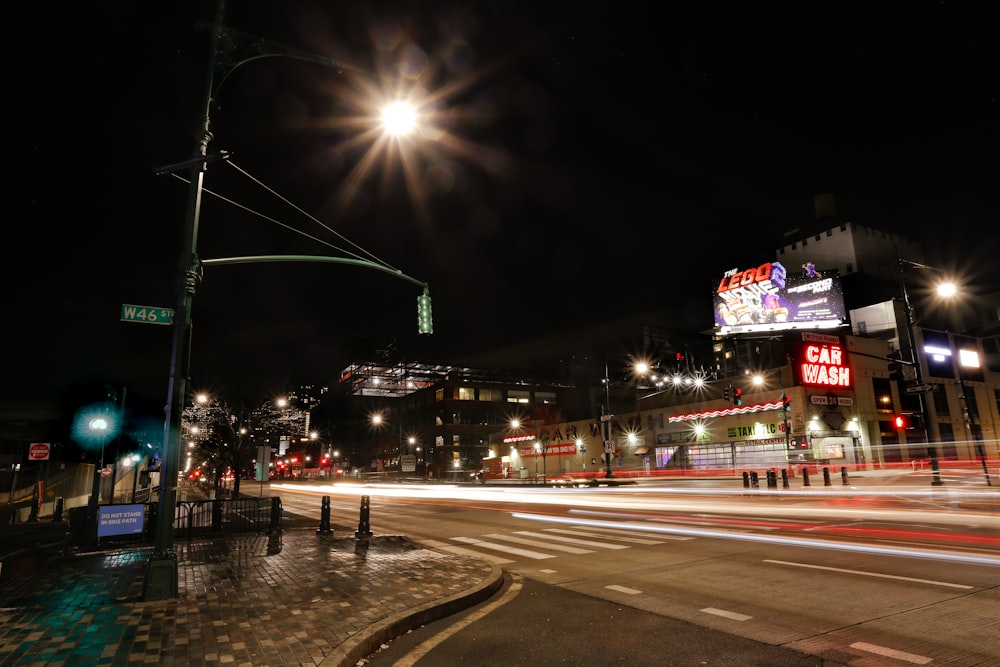 time-lapse photography of cars on road at night time