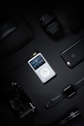 A collection of multimedia devices including headphones and speakers.