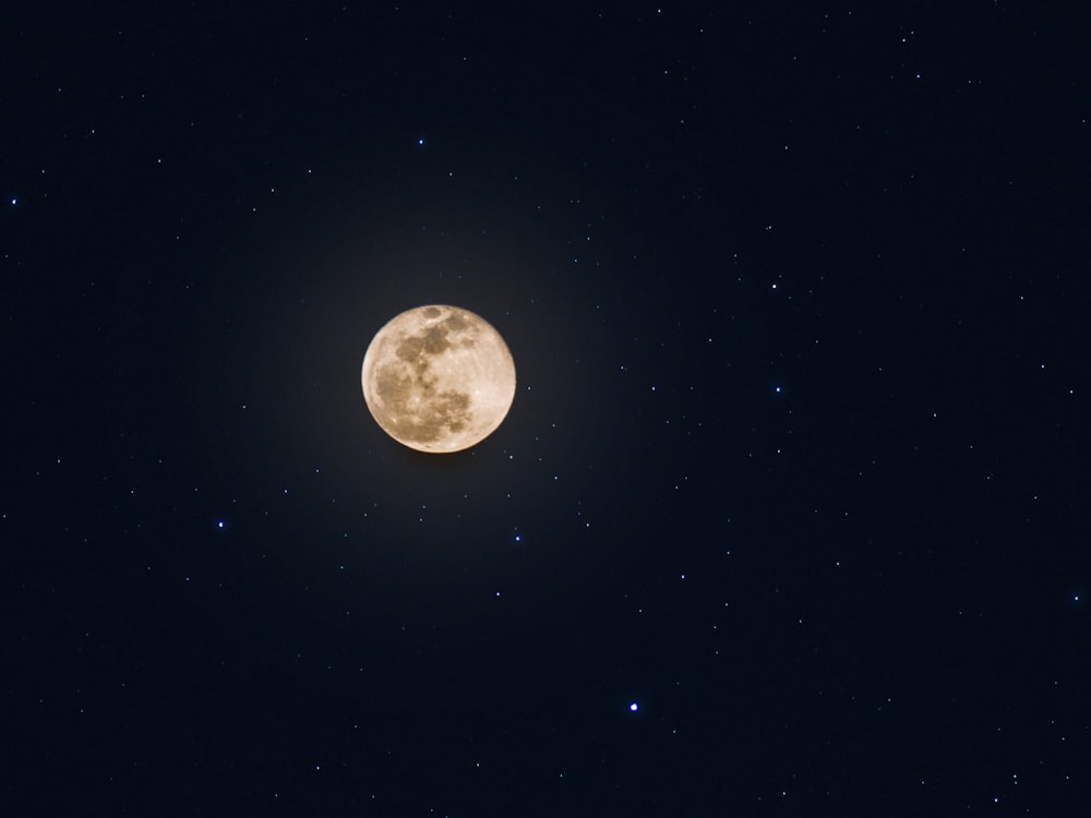 full moon and brightening stars at night sky