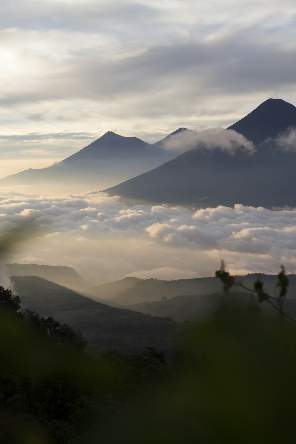 mountains under cloudy sky during daytime