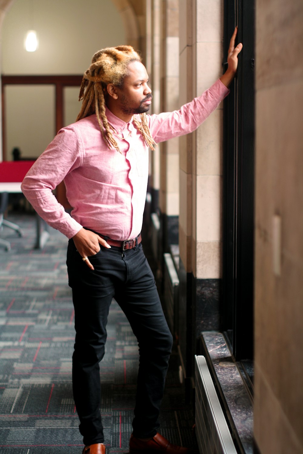 man leaning against wall