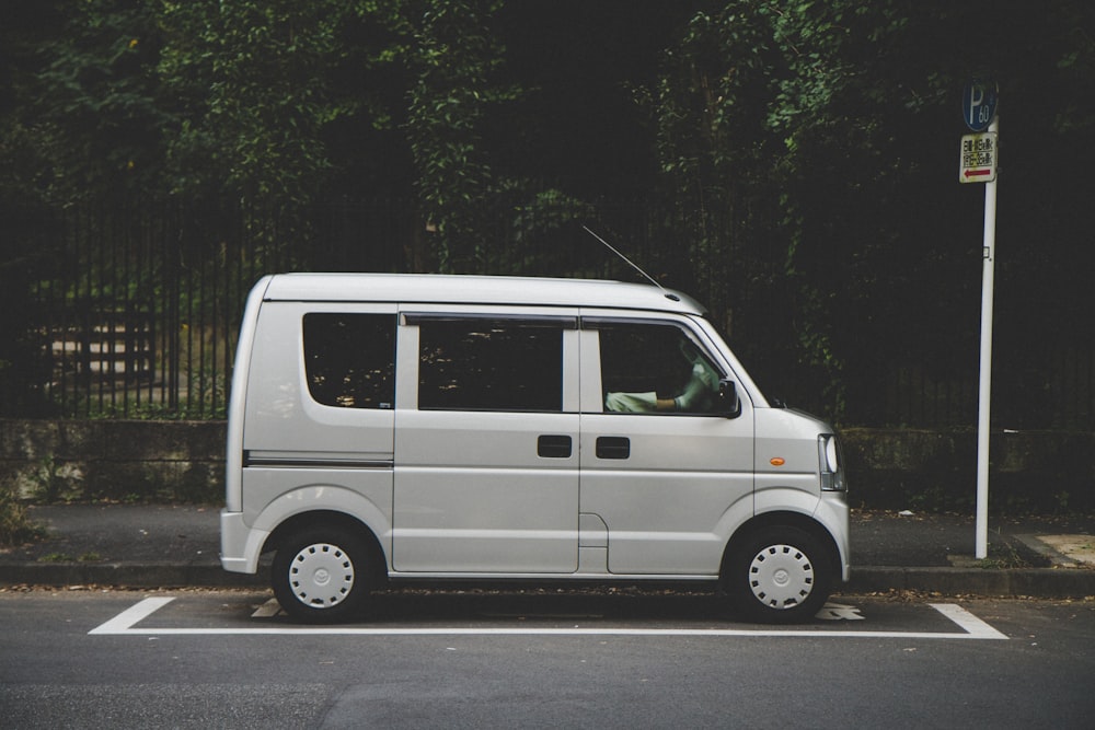 silver minivan on parking lot