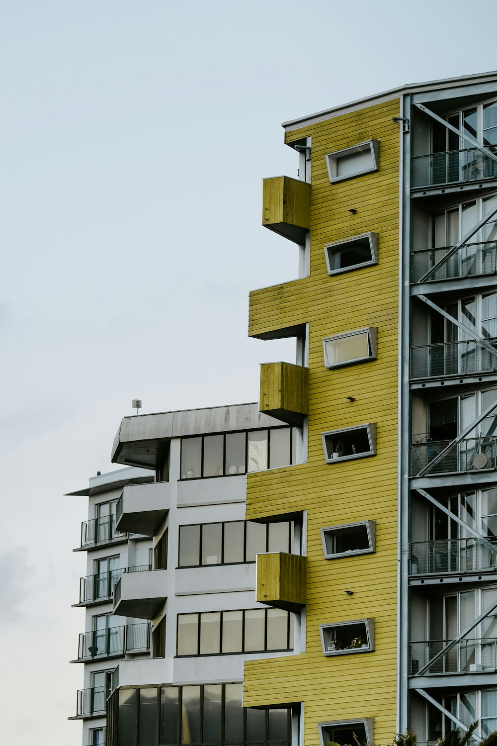 yellow and gray concrete building under white sky